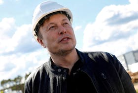 FILE PHOTO: SpaceX founder and Tesla CEO Elon Musk looks on as he visits the construction site of Tesla's gigafactory in Gruenheide, near Berlin, Germany, May 17, 2021. REUTERS/Michele Tantussi  SpaceX founder and Tesla CEO Elon Musk looks on as he visits the construction site of Tesla's gigafactory in Gruenheide, near Berlin, Germany, May 17, 2021. REUTERS/Michele Tantussi