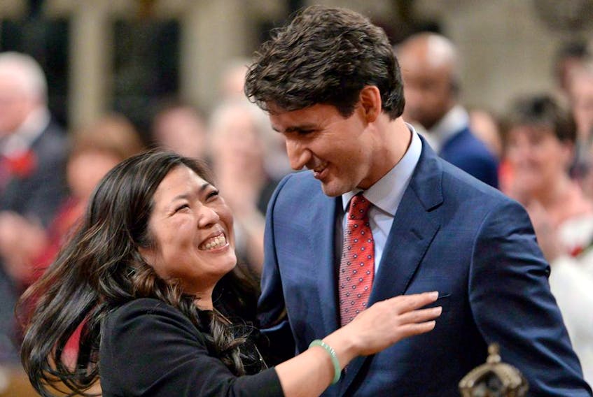 Newly-elected Liberal MP Mary Ng hugs Prime Minister Justin Trudeau as she is escorted into the House of Commons on May 3, 2017.