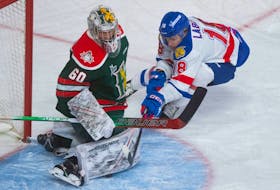Moncton Wildcats centre Vincent Labelle tries to shove the puck under the pad of Halifax Mooseheads goalie Mathis Rousseau during Wednesday night's QMJHL game on Dec. 14, 2022.
Ryan Taplin - The Chronicle Herald