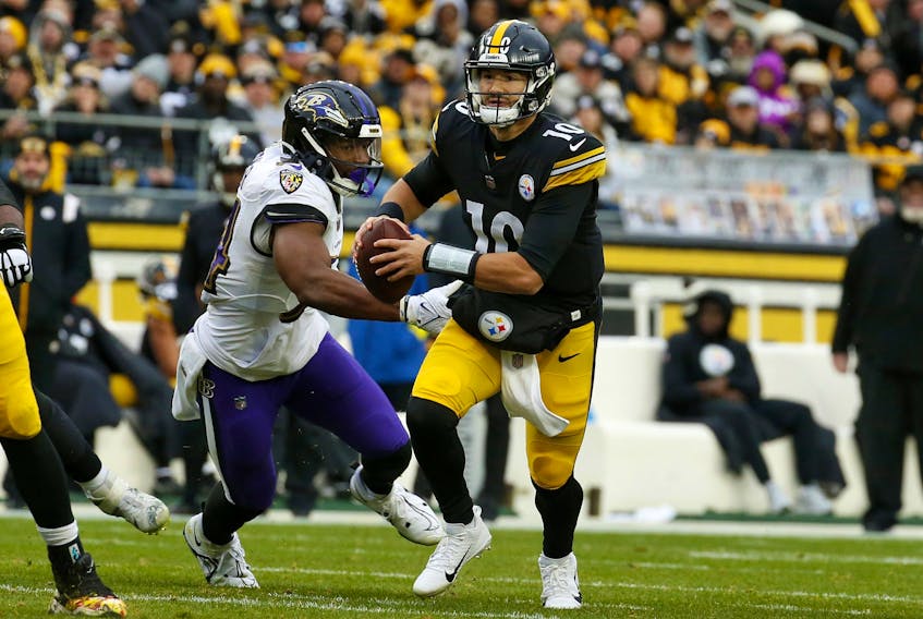 Mitch Trubisky of the Pittsburgh Steelers scrambles with the ball during the fourth quarter of the game at Acrisure Stadium on December 11, 2022 in Pittsburgh, Pennsylvania. 