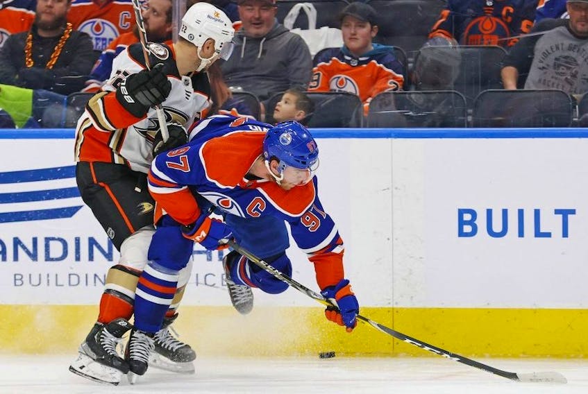  Anaheim Ducks defenceman Kevin Shattenkirk battles along the boards with Edmonton Oilers forward Connor McDavid at Rogers Place Saturday night. USA TODAY Sports