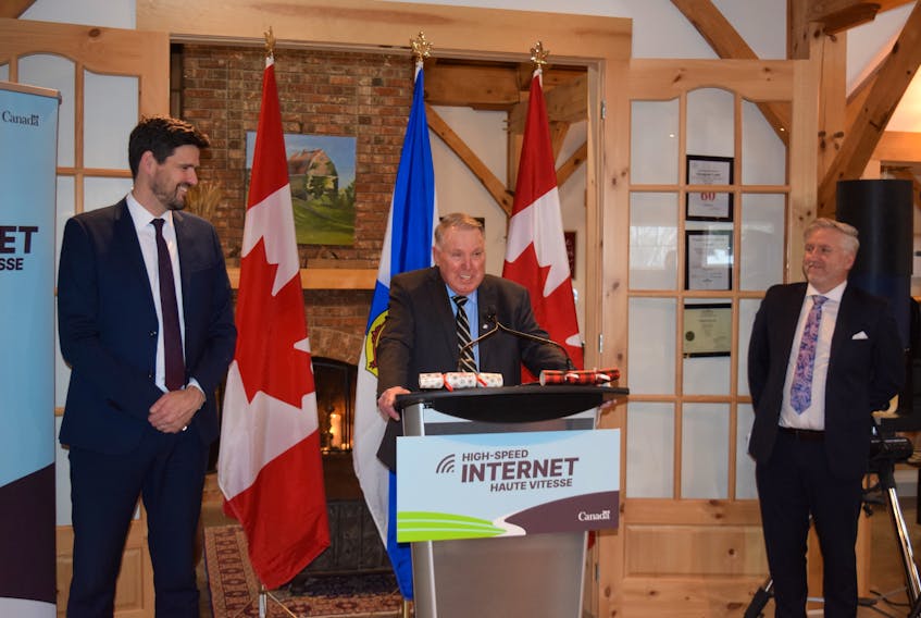 Warden Robert Parker, centre, was happy to hear that the federal government will be investing up to $31 million to the Municipality of Pictou County's rural Internet project. Central Nova MP Sean Fraser, left, made the announcement on Dec. 19.