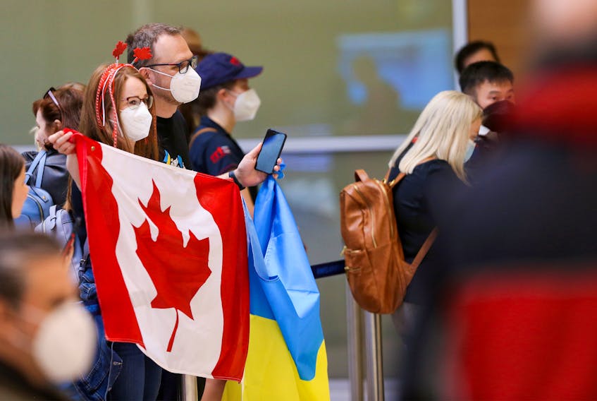 Ukrainians fleeing Russia's invasion arrive in Winnipeg, home to a large Ukrainian diaspora, at the James Armstrong Richardson International Airport on May 23.  REUTERS/Shannon VanRaes
