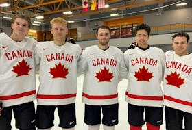 Shane Wright (middle) has been named captain of Team Canada for the upcoming IIHF World Junior Championship in Halifax and Moncton. From left to right are alternate captains Ethan Del Mastro, Nathan Gaucher, Dylan Guenther and Logan Stankoven. - HOCKEY CANADA