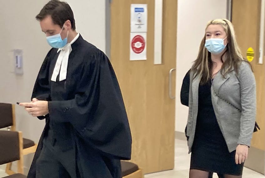 Miranda Lynn Taylor follows her lawyer, Alex Pate, out of Nova Scotia Supreme Court in Dartmouth during a break at her trial on a charge of being an accessory after the fact to the July 2019 murder of Triston Reece and two counts of intimidation of a justice system participant.