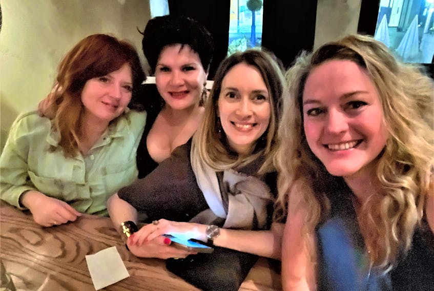 Emilie Chiasson, second from left, recently reunited with her old friends and roommates while visiting Toronto. From left are Kelly, Chiasson, Sue and Alexis. - Contributed