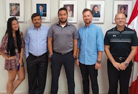 The Pivot Airlines crew arrested and jailed after finding and reporting cocaine stashed on their plane in the Dominican Republic. From left, flight attendant Christina Carello, mechanic BK Dubey, First Officer Aatif Safdar, flight attendant Alexander Rozov and Capt. Rob DiVenanzo, at a recent citizenship ceremony for Dubey.