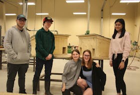 Holland College transitions students Dylan Brander, left, Jysiah McEwen, Lily Woon, Robyn Rix and Xialeel Gabriel stand beside the two cat houses they built this semester for the Cat Action Team. – Kristin Gardiner