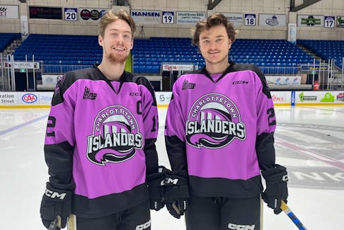 Charlottetown Islanders forward and captain Keiran Gallant, left, and forward Owen Hollingsworth sport the specially-designed uniforms the team will wear for Hockey Fights Cancer Night at Eastlink Centre on Dec. 3. The Islanders will host the Cape Breton Eagles in a Quebec Major Junior Hockey League game at 7 p.m. Charlottetown Islanders Photo • Special to The Guardian