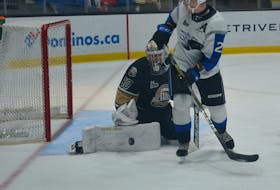 Charlottetown Islanders goaltender Franky Lapenna makes a save off a redirection attempt by Saint John Sea Dogs forward Connor Trenholm. The action took place during a Quebec Major Junior Hockey League (QMJHL) game at Eastlink Centre earlier this season. The Islanders traded Lapenna to the Gatineau Olympiques on Dec. 19. Jason Simmonds • The Guardian