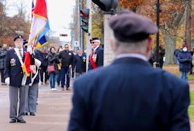 A veteran looks on as Colour Party members carry flags during a Remembrance Day ceremony in Charlottetown on Nov. 11, 2021. Veterans Affairs Minister Lawrence MacAulay says veterans needing assistance from his department should not hesitate to call despite negative stories in the news lately. SaltWire Network file