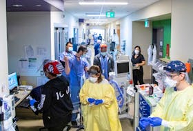 Nurses, doctors, and respiratory therapist prepare to intubate a COVID-19 patient as Omicron puts pressure on Humber River Hospital in Toronto, Ontario, Canada January 20, 2022.