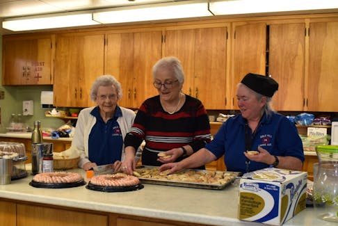 Volunteers from the Bible Hill Fire Brigade Ladies Auxiliary preparing lunch at the Village of Bible Hill levee in 2020. The new year tradition is making a return since COVID began.