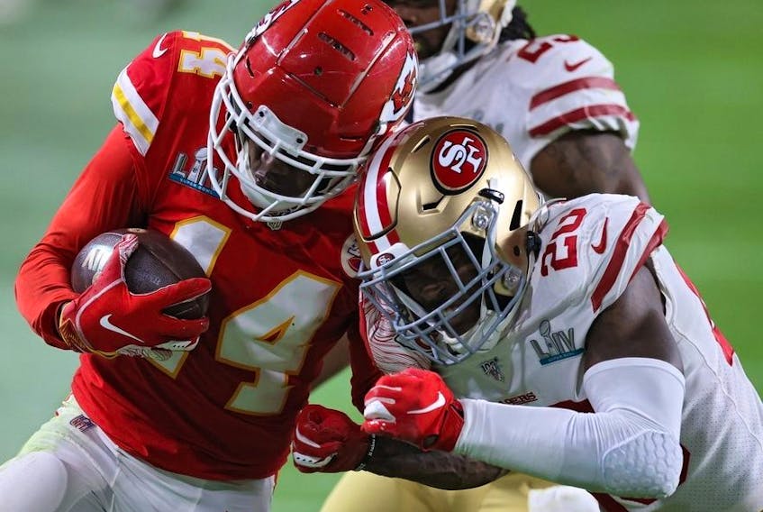 Sammy Watkins of the Kansas City Chiefs is tackled by Jimmie Ward of the San Francisco 49ers Super Bowl LIV at Hard Rock Stadium on February 02, 2020 in Miami, Florida.