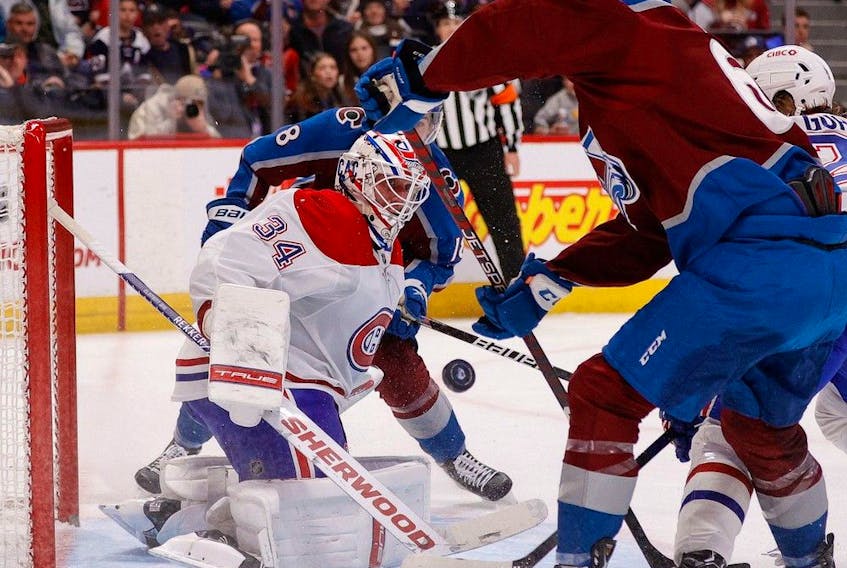 Canadiens goalie Jake Allen makes save during second period of Wednesday night’s game against the Colorado Avalanche at Ball Arena in Denver.