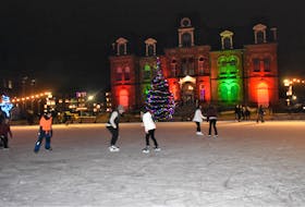 Folks enjoying the downtown ice surface which was lit up by the Christmas lights around Civic Square. Richard MacKenzie
