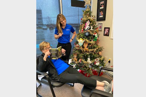 Laura Lunquist, standing, playfully reminds physio assistant Jane Robichaud to sit properly. Sitting for too long or in bad positions can cause back pain but there are simple ways to address that issue. CONTRIBUTED