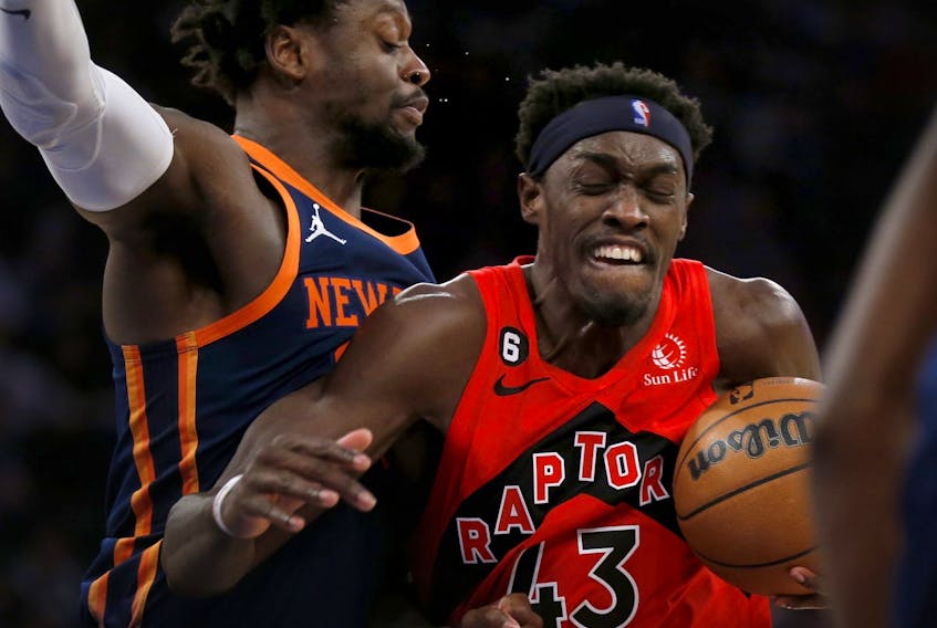 Toronto Raptors forward Pascal Siakam  drives past New York Knicks forward Julius Randle, left, during the first half of an NBA basketball game Wednesday, Dec. 21, 2022, in New York.  