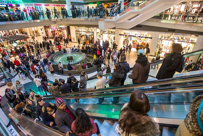  Shoppers crowd the Eaton Centre mall in Toronto. This holiday season retailers have found it difficult to find extra help to cover the rush.
