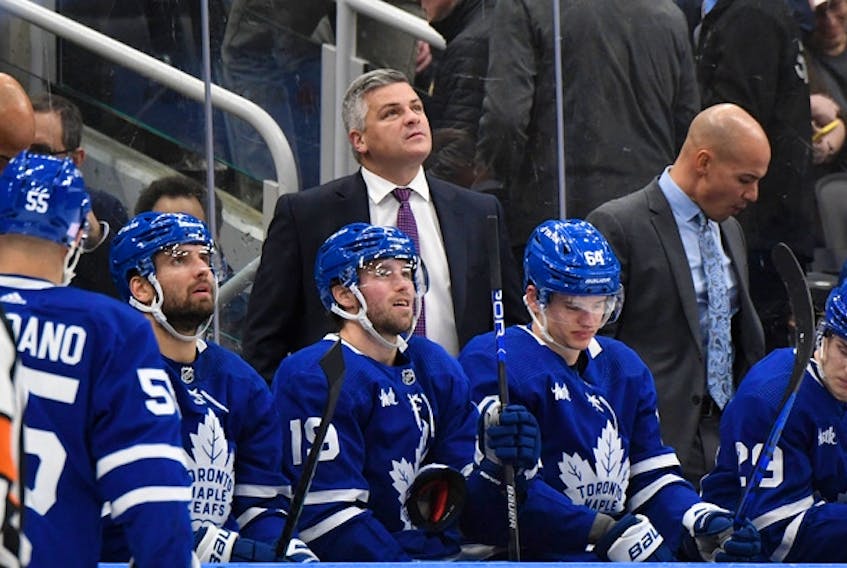 Maple Leafs head coach Sheldon Keefe looks up at the video board during a break in play against the New Jersey Devils at Scotiabank Arena.