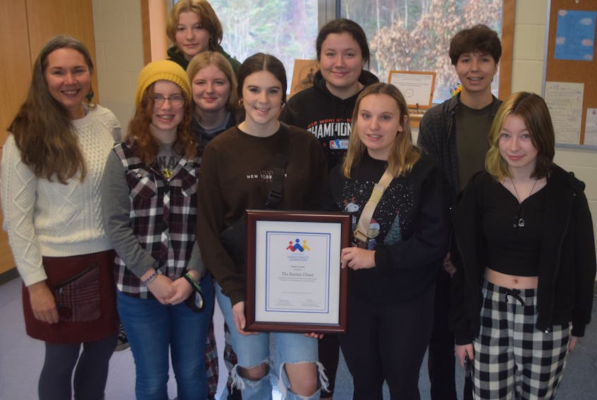 The Karma Closet program at Northumberland Regional High School was recently recognized with a Nova Scotia Human Rights Award. A few of the members of the group are show here with the award. In front from left: teacher/advisor Karen Berezowski, Audrey Taylor, Molly Rowan, Mallory Matlock and Alexia Booth. Second row from left: Katelyn Haynes, Josie Dunn and Elara Ehler. Lilly MacDonald is in the back row.