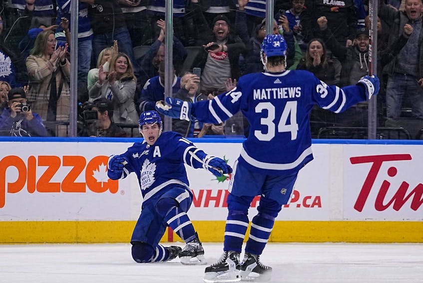  Toronto Maple Leafs forward Mitchell Marner with forward Auston Matthews after scoring the game winning goal against the Calgary Flames during overtime at Scotiabank Arena. (John E. Sokolowski-USA TODAY Sports)