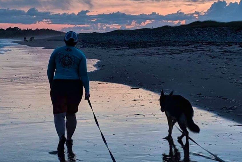 Denice Nicholson and Dilly at Lawrencetown Beach. Nicholson, who was new to dog ownership when she committed to training, says the experience has changed her as a person for the better. Contributed photo