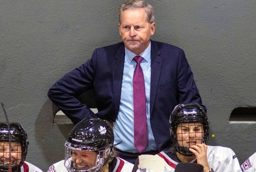 Montreal Force head coach Peter Smith watches his team's first Premier Hockey League home game against the Metropolitan Riveters in Verdun on Nov. 26, 2022.