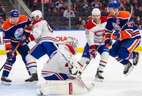 Canadiens goalie Jake Allen makes the save as Edmonton Oilers' Connor McDavid (97) jumps during second period NHL action in Edmonton on Saturday, Dec. 3, 2022.