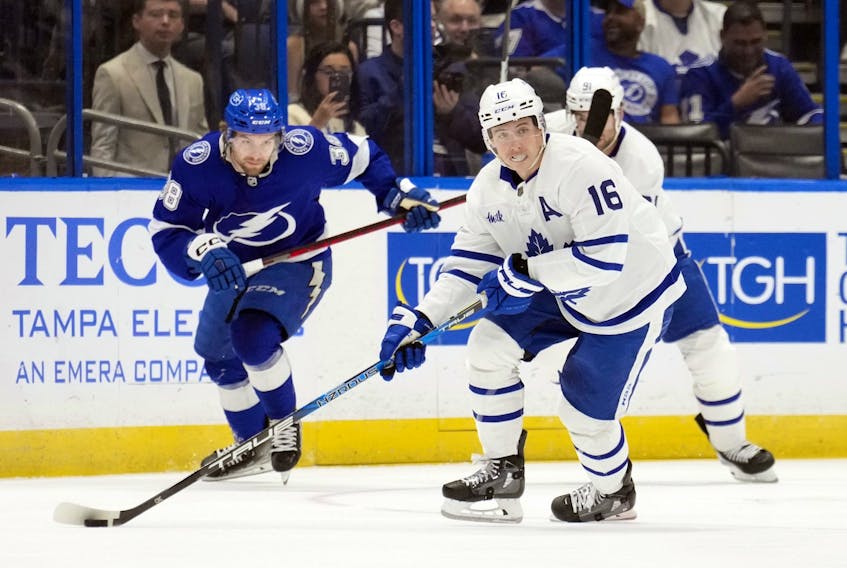 Maple Leafs' Mitch Marner starts the breakout in front of Tampa Bay Lightning's Brandon Hagel during the first period on Saturday, Dec. 3, 2022, in Tampa, Fla. 