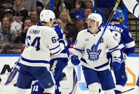 Maple Leafs' Mitch Marner (right) celebrates his goal against the Tampa Bay Lightning with teammate David Kampf during the second period on Saturday, Dec. 3, 2022.