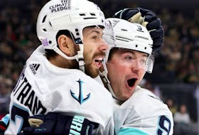 Oliver Bjorkstrand and Ryan Donato of the Seattle Kraken celebrate Donato's first-period goal against the Vegas Golden Knights during their game at T-Mobile Arena on November 25, 2022 in Las Vegas, Nevada. 