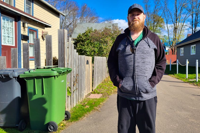 Craig Jones, a Charlottetown resident, stands in front of the narrow lane where he lives. Island Waste Management did not collect garbage on his street from Sept. 1 until Oct. 24. Logan MacLean • The Guardian