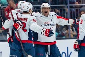 Washington Capitals forward Alex Ovechkin (8) celebrates with forward Dylan Strome, left, after defenceman Martin Fehervary (42) scored a goal during the first period against the Seattle Kraken at Climate Pledge Arena on Dec. 1, 2022. 