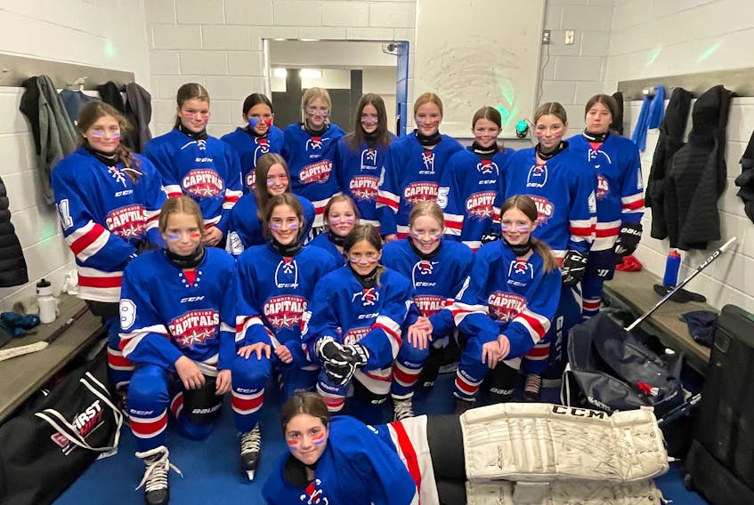 The Summerside Team Two Capitals (McNeill) recently went undefeated in winning the Centennial Auto Group 2022 female under-13 A hockey tournament at Credit Union Place. The Capitals defeated the Miramichi Team One Panthers 4-1 in the championship game. Members of the Capitals are Claire Dowling, lying in front, and seated, from left: Sadie DesJardins, Emmy DesRoches, Maggie Mulligan (No. 12, behind DesRoches), Grace Hickox, Kyliee Pendergast (behind Hickox), Lexi Yeo, and Claire Morrissey. Back row: Kryssa-Lee Yeo, Madison Duguay, Siiguon Ledwell-Cox, Maci Benoit, Blair Gallant, Brynn McNeill, Ava Noonan, Payton MacLellan, and Millar Perry. Contributed