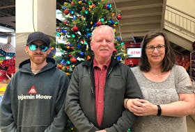 In 2019, Violet Wright lost her battle with bowel cancer. In November 2022, her son Josh Richards, left, and husband George Wright were reconnected with Hospice P.E.I. volunteer Lisa Arsenault, who had cared for Violet in her final months. – Kristin Gardiner