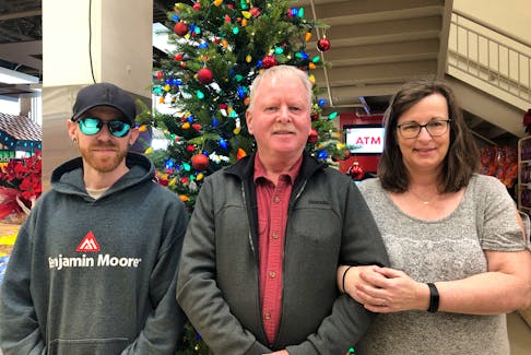 In 2019, Violet Wright lost her battle with bowel cancer. In November 2022, her son Josh Richards, left, and husband George Wright were reconnected with Hospice P.E.I. volunteer Lisa Arsenault, who had cared for Violet in her final months. – Kristin Gardiner