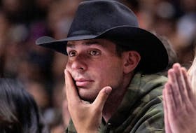 Montreal Canadiens' Carey Price watches a preseason NBA game in Montreal on Friday, Oct. 14, 2022.