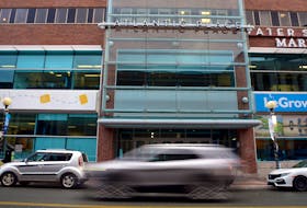 A vehicle passes by Atlantic Place on Water Street in downtown St. John's.

Keith Gosse/The Telegram