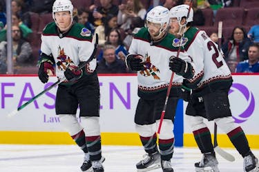 Defenceman Jakob Chychrun, left, seen celebrating his goal against the Vancouver Canucks on Dec. 3, 2022, has been on a tear since returning to the Arizona Coyotes' lineup and is available, but the asking price remains high.