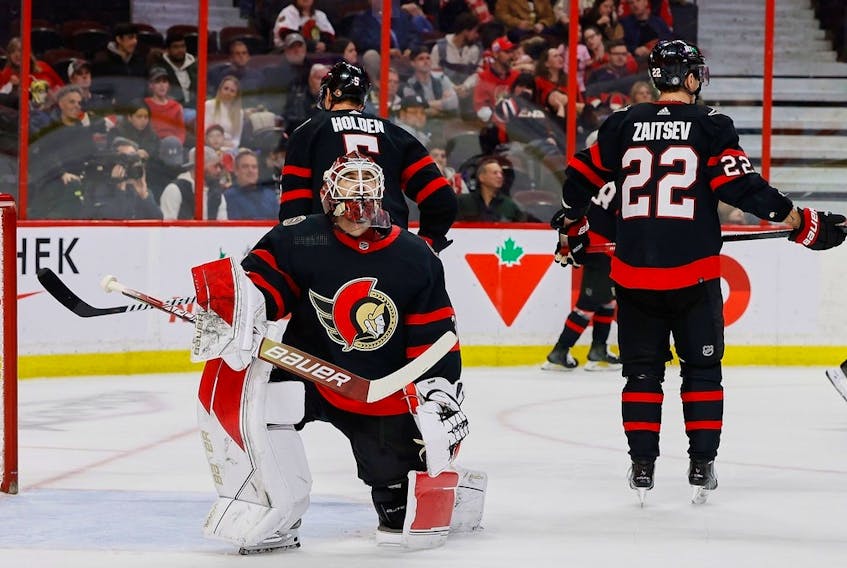 Ottawa Senators goaltender Cam Talbot and defencemen Nick Holden and Nikita Zaitsev react after the Los Angeles Kings scored their fifth goal of the game during second period NHL action at the Canadian Tire Centre on Tuesday, Dec. 6, 2022.