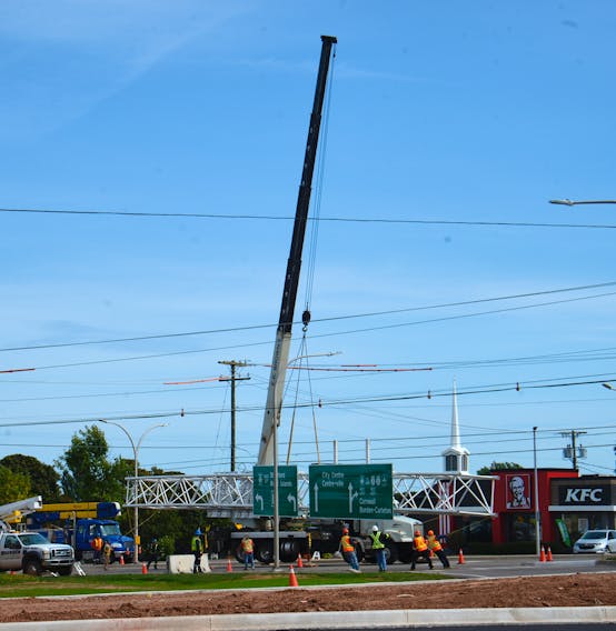 Crews install overhead signs on Route 2, St. Peters Road where the province opened its first displaced left-turn intersection in September 2020. SaltWire Network file
