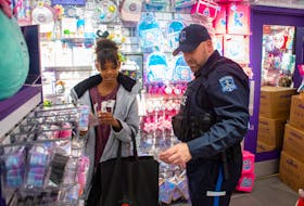 Lydia Graylee, 10, gets a shopping assist from Detective Constable Aaron Head during the 18th annual CopShop at the Halifax Shopping Centre on Wednesday, Dec. 7, 2022.
Ryan Taplin - The Chronicle Herald