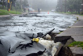 Flooding from overnight rains dropped by post-hurricane Earl tore up parts of Old Patty Harbour Road Monday.

Keith Gosse/The Telegram