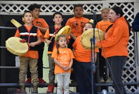 Plymouth School children perform the Honour Song with Sarah Swinamer prior to Every Child Matters presentations by the different classes. TINA COMEAU PHOTO