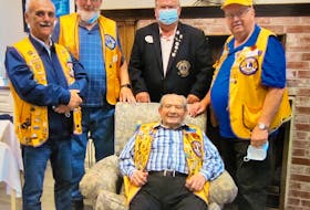 On Nov. 7, Sydney Lions Club members gathered at the Cove Guest Home in Sydney to present Lion Harry Sophocleous, seated, with his 60-year pin. From the left are, Bob Jardine, Dave Richards, District Governor Bill Bruhm, and Bob Bowins. CONTRIBUTED