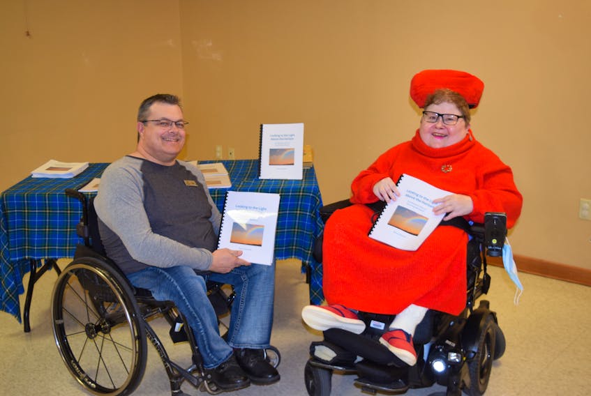 Nancy Marshall has written a book about dealing with depression. She held a launch on Dec. 2. Her case worker from Nova Scotia Works Jason MacDonald, left, attended.