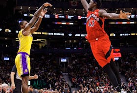 Lonnie Walker IV #4 of the Los Angeles Lakers puts a shot up over Pascal Siakam #43 of the Toronto Raptors during the second half of their NBA game at Scotiabank Arena on December 7, 2022.