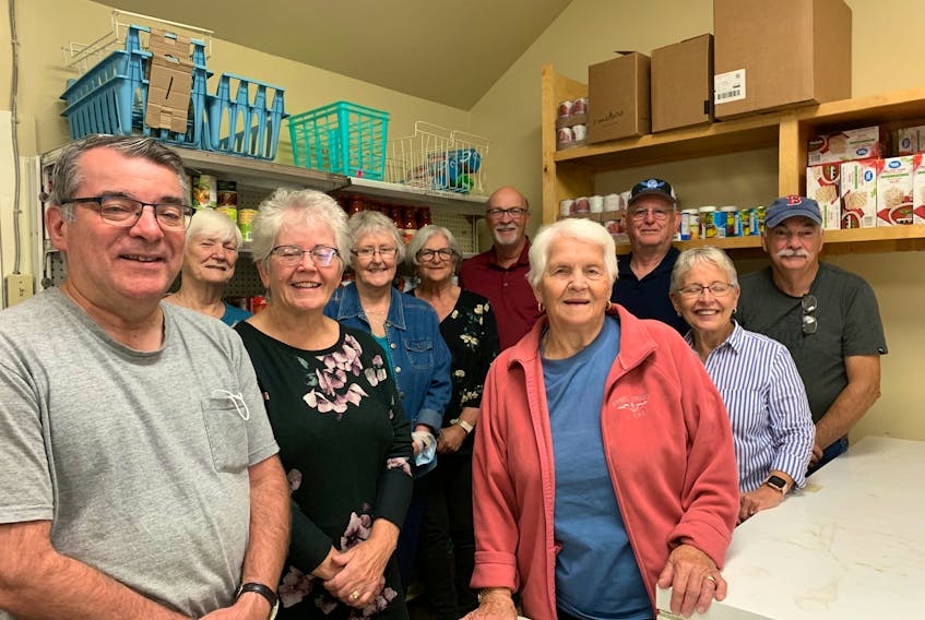 The Sydney Mines Food Bank Society is celebrating 30 years of food assistance to the less fortunate members of the community. Food bank volunteers shown, front row, from left, include Dale Romeo, Norma Baxter, Ruby Pye, Karen McCarthy, Audrey MacDougall and Lawrence MacDougall; and back row, from left, Ina Taylor, Debbie Carey, Joyce Corey, Paul Browne and Dirk Krikke. Contributed