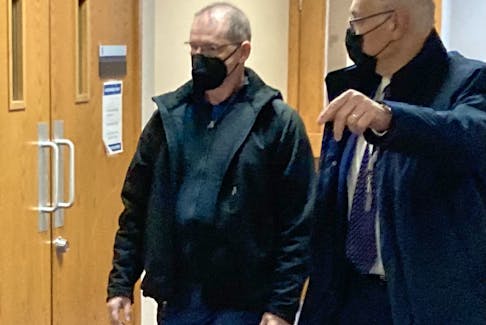 Former Cole Harbour teacher Sean Patrick Palmer, left, leaves Dartmouth provincial court with lawyer Ron Pizzo on Dec. 9 after being sentenced for luring and sexually assaulting a 14-year-old student in 2020. The Ontario resident received an eight-month conditional sentence of house arrest, followed by three years' probation.